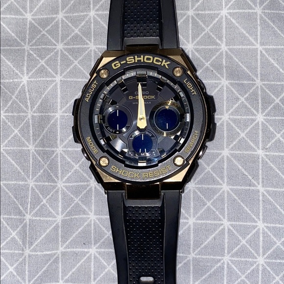 Black/Gold Casio G-SHOCK sport watch.